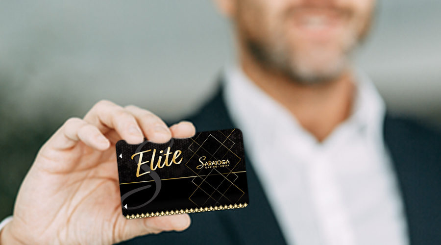 Man holding Saratoga Club Diamond Elite membership card