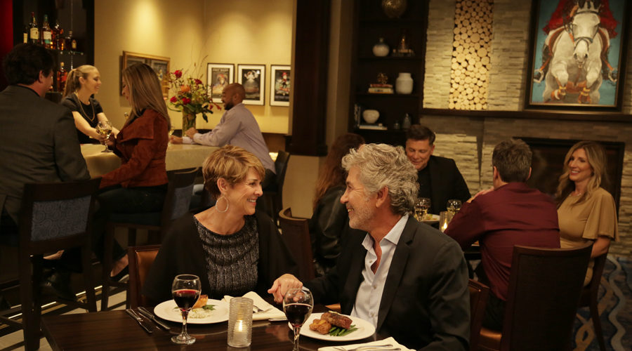 Couple dining in intimate VIP lounge