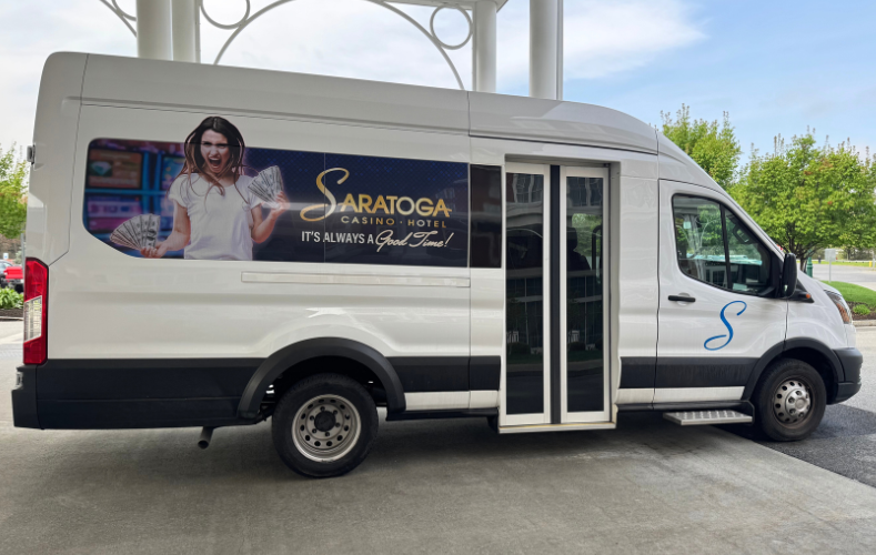 Saratoga Casino hotel shuttle parked outside of the hotel